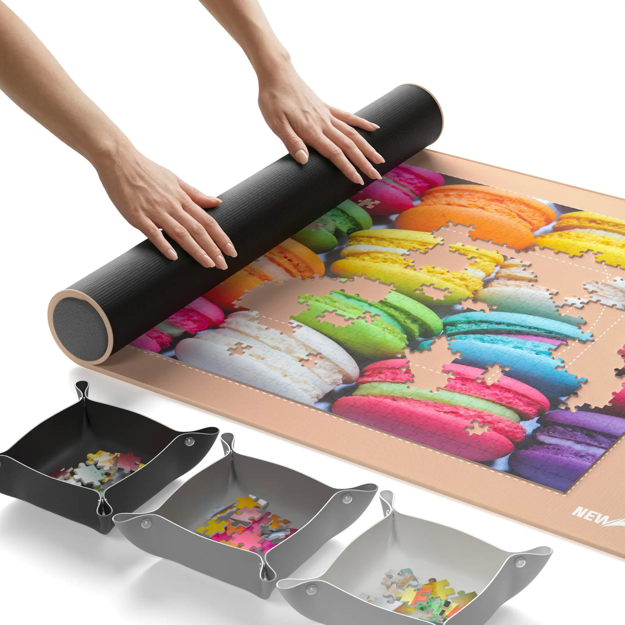 Newverest Rose Gold puzzle mat being rolled up with sorting trays